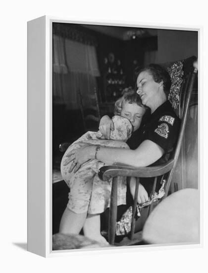 Den Mother Still in Uniform, Sleeping While Holding Her Daughter-null-Framed Premier Image Canvas