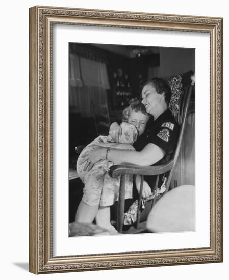 Den Mother Still in Uniform, Sleeping While Holding Her Daughter-null-Framed Photographic Print