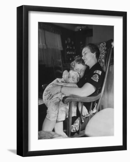 Den Mother Still in Uniform, Sleeping While Holding Her Daughter-null-Framed Photographic Print