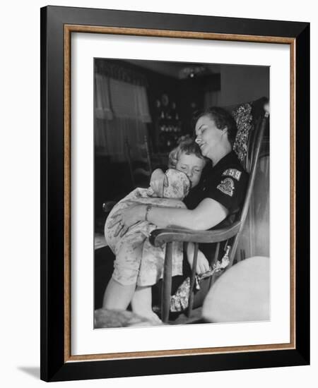 Den Mother Still in Uniform, Sleeping While Holding Her Daughter-null-Framed Photographic Print