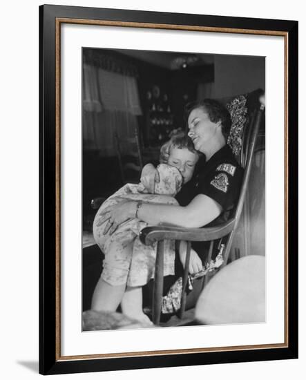 Den Mother Still in Uniform, Sleeping While Holding Her Daughter-null-Framed Photographic Print