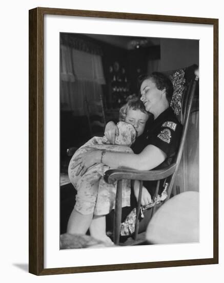 Den Mother Still in Uniform, Sleeping While Holding Her Daughter-null-Framed Photographic Print