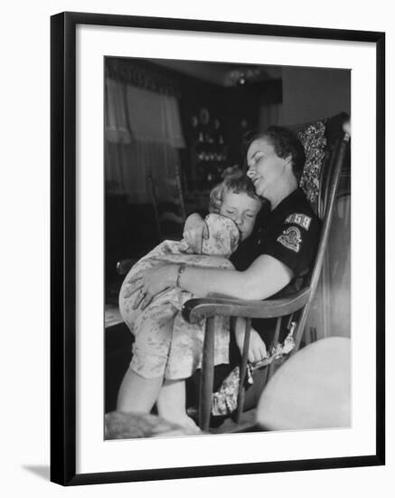 Den Mother Still in Uniform, Sleeping While Holding Her Daughter-null-Framed Photographic Print