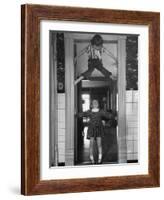 Denise Bruene Climbing Kitchen Door in Bare Feet, Her Hobby, Jan Bruene Says "Don't Fall on Me"-Gordon Parks-Framed Photographic Print