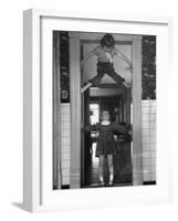 Denise Bruene Climbing Kitchen Door in Bare Feet, Her Hobby, Jan Bruene Says "Don't Fall on Me"-Gordon Parks-Framed Photographic Print