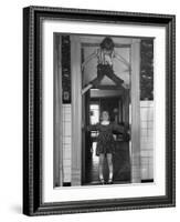 Denise Bruene Climbing Kitchen Door in Bare Feet, Her Hobby, Jan Bruene Says "Don't Fall on Me"-Gordon Parks-Framed Photographic Print
