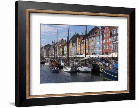 Denmark, Copenhagen, Nyhavn district. Colorful 17th and 18th century buildings, boats and canal-Alan Klehr-Framed Photographic Print