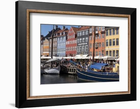 Denmark, Copenhagen, Nyhavn district. Colorful 17th and 18th century buildings, boats and canal-Alan Klehr-Framed Photographic Print