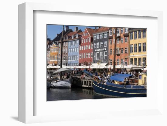 Denmark, Copenhagen, Nyhavn district. Colorful 17th and 18th century buildings, boats and canal-Alan Klehr-Framed Photographic Print