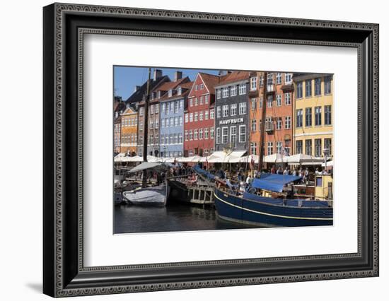 Denmark, Copenhagen, Nyhavn district. Colorful 17th and 18th century buildings, boats and canal-Alan Klehr-Framed Photographic Print