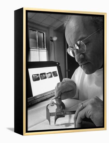 Dentist Dr. Harland Measuring Tooth to Be Used in Medical Dentistry-J^ R^ Eyerman-Framed Premier Image Canvas