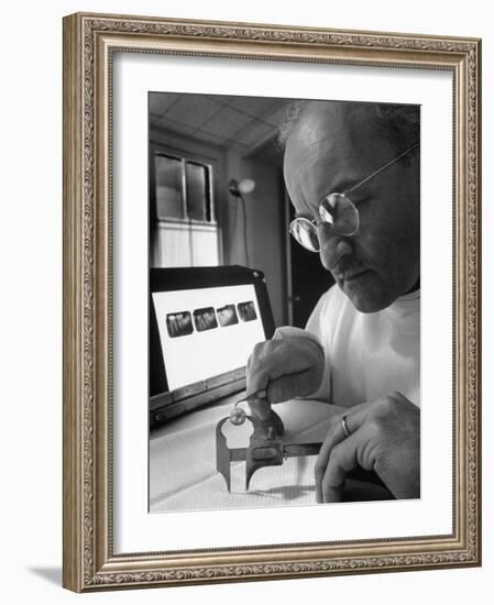 Dentist Dr. Harland Measuring Tooth to Be Used in Medical Dentistry-J^ R^ Eyerman-Framed Photographic Print