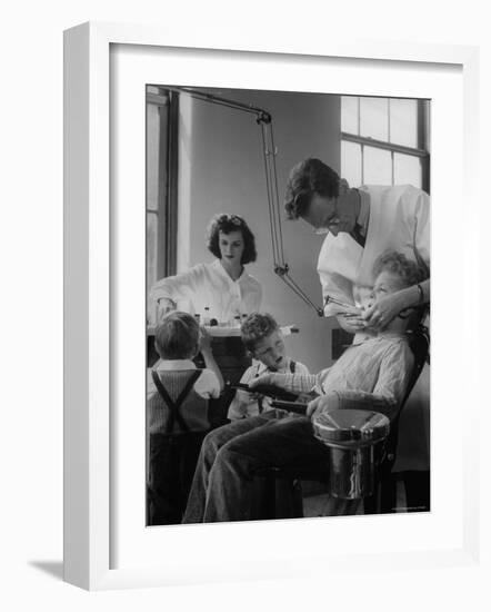 Dentist Examining a Young Boy-Nina Leen-Framed Photographic Print