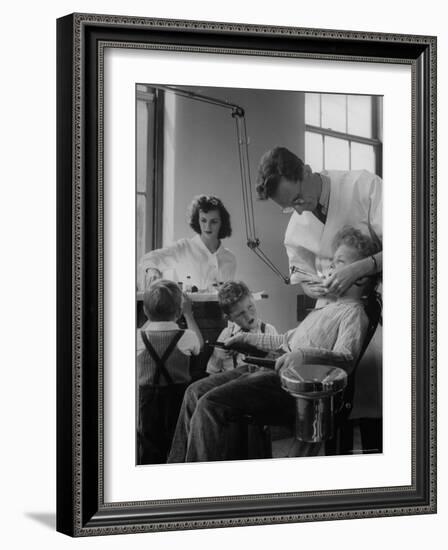 Dentist Examining a Young Boy-Nina Leen-Framed Photographic Print