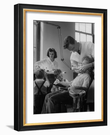 Dentist Examining a Young Boy-Nina Leen-Framed Photographic Print