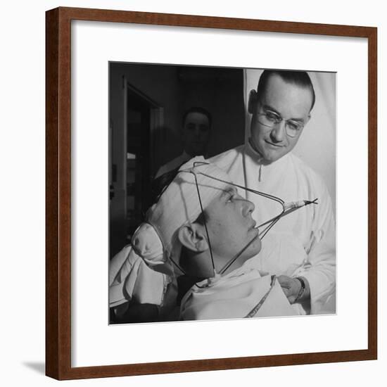 Dentist Working on a Soldier's Mouth at the Ft. Meade and Walter Reed Dental Hospital-George Strock-Framed Photographic Print