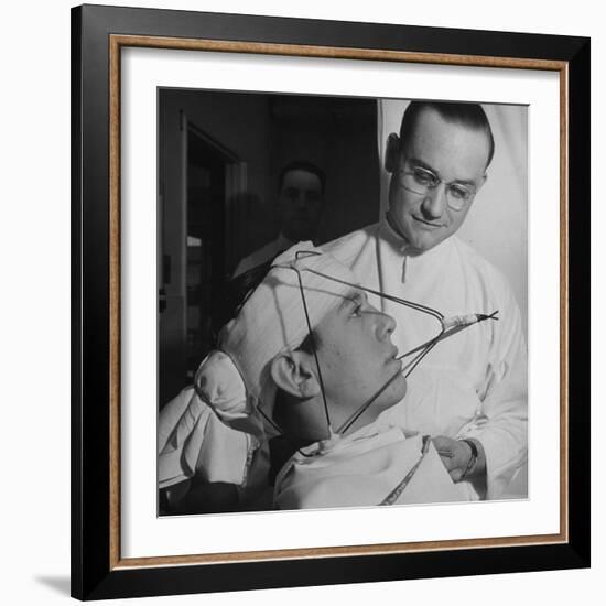 Dentist Working on a Soldier's Mouth at the Ft. Meade and Walter Reed Dental Hospital-George Strock-Framed Photographic Print