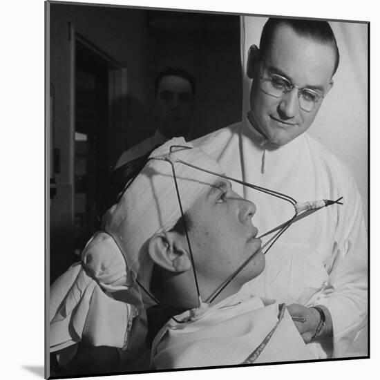 Dentist Working on a Soldier's Mouth at the Ft. Meade and Walter Reed Dental Hospital-George Strock-Mounted Photographic Print