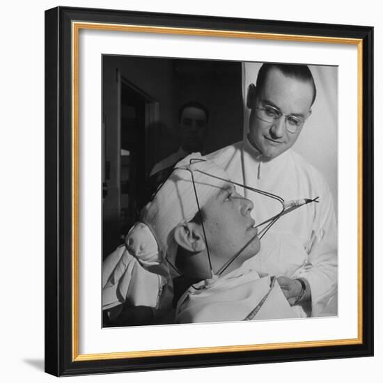 Dentist Working on a Soldier's Mouth at the Ft. Meade and Walter Reed Dental Hospital-George Strock-Framed Photographic Print