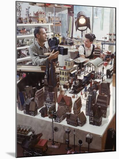 Designers Charles Eames and Wife Ray Eames Filming Toy Trains at Their Studio-Allan Grant-Mounted Premium Photographic Print
