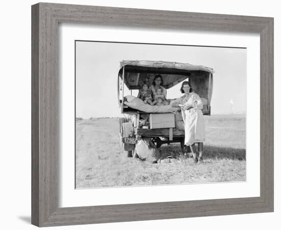 Destitute Texan family leave their home to seek work in Arkansas cotton fields, 1936-Dorothea Lange-Framed Photographic Print