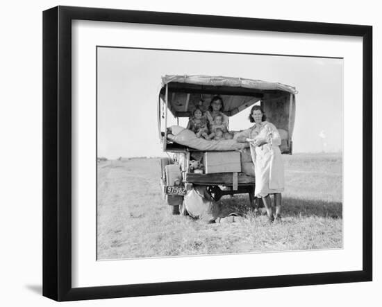 Destitute Texan family leave their home to seek work in Arkansas cotton fields, 1936-Dorothea Lange-Framed Photographic Print