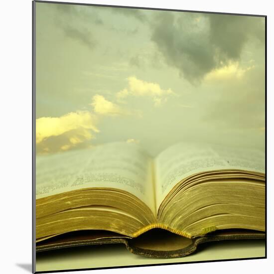 Detail of an Old Holy Bible Open with a Beautiful and Mystical Sky in the Background in a Golden Li-Valentina Photos-Mounted Photographic Print