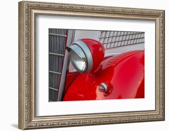 Detail of head lamp on red classic American Ford in Habana, Havana, Cuba.-Janis Miglavs-Framed Photographic Print