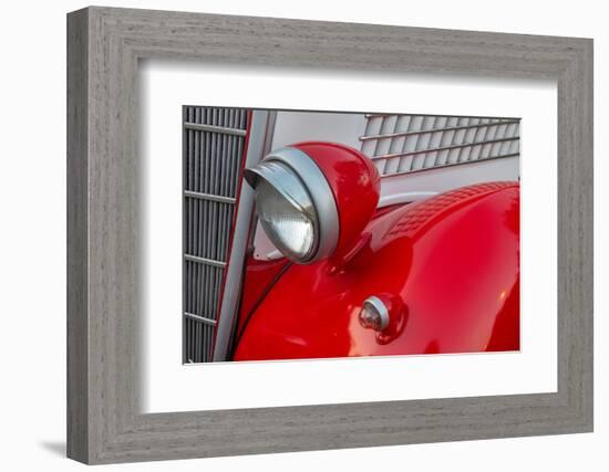 Detail of head lamp on red classic American Ford in Habana, Havana, Cuba.-Janis Miglavs-Framed Photographic Print