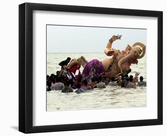 Devotees Immerse a Giant Clay Idol of Hindu Elephant-Headed God Ganesh into the Arabian Sea, Bombay-null-Framed Photographic Print