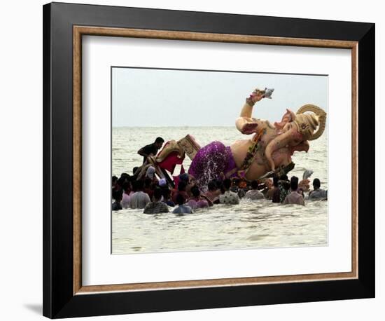 Devotees Immerse a Giant Clay Idol of Hindu Elephant-Headed God Ganesh into the Arabian Sea, Bombay-null-Framed Photographic Print