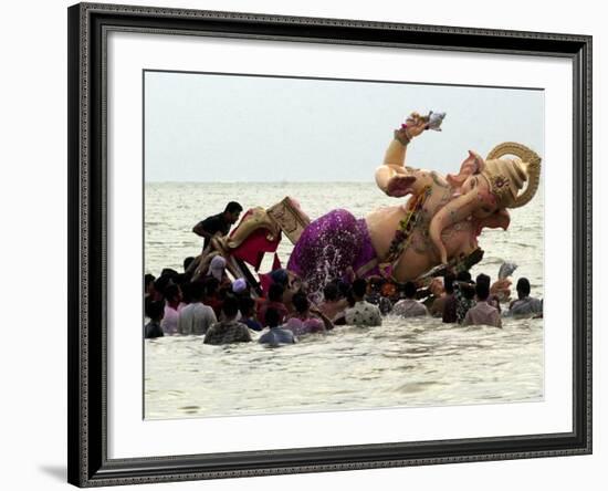 Devotees Immerse a Giant Clay Idol of Hindu Elephant-Headed God Ganesh into the Arabian Sea, Bombay-null-Framed Photographic Print