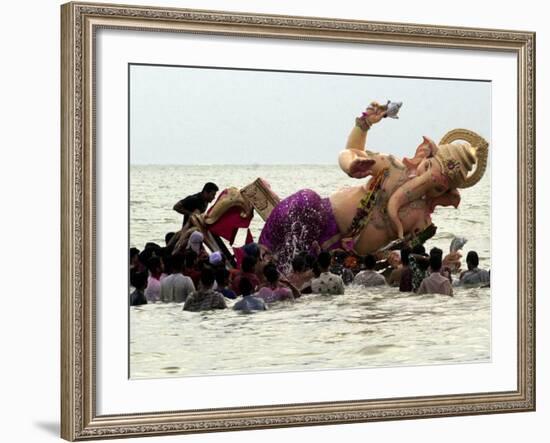 Devotees Immerse a Giant Clay Idol of Hindu Elephant-Headed God Ganesh into the Arabian Sea, Bombay-null-Framed Photographic Print