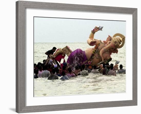 Devotees Immerse a Giant Clay Idol of Hindu Elephant-Headed God Ganesh into the Arabian Sea, Bombay-null-Framed Photographic Print