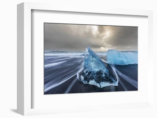 Diamond ice chards from calving icebergs on black sand beach, Jokulsarlon, south Iceland-Chuck Haney-Framed Photographic Print