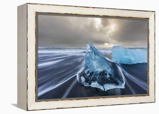 Diamond ice chards from calving icebergs on black sand beach, Jokulsarlon, south Iceland-Chuck Haney-Framed Premier Image Canvas