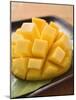Diced Mango Still Attached to the Skin on Brown Plate-null-Mounted Photographic Print