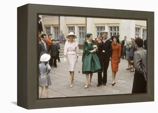 Dior Models Posing with Military Man in the Soviet Union, Moscow, Russia, 1959-Howard Sochurek-Framed Premier Image Canvas