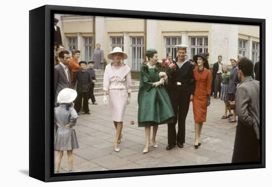 Dior Models Posing with Military Man in the Soviet Union, Moscow, Russia, 1959-Howard Sochurek-Framed Premier Image Canvas