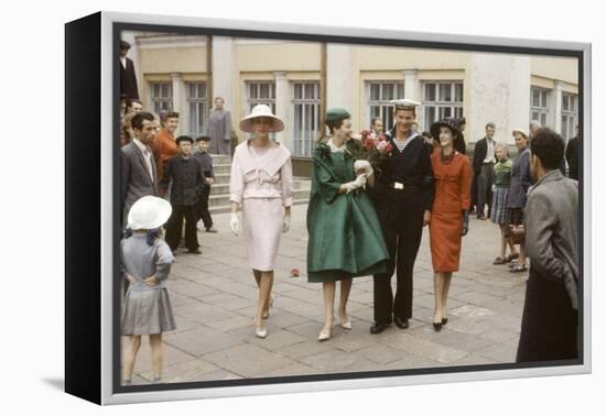 Dior Models Posing with Military Man in the Soviet Union, Moscow, Russia, 1959-Howard Sochurek-Framed Premier Image Canvas