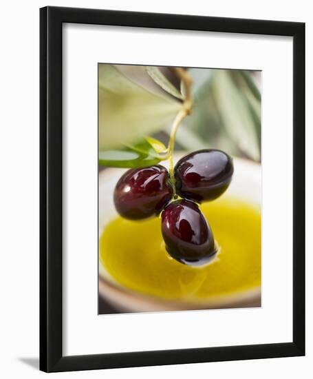 Dipping Olive Sprig with Black Olives in Olive Oil-null-Framed Photographic Print