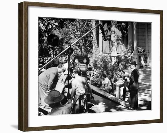 Director Alfred Hitchcock, Bending over to Watch a Rehearsal Through the Camera-J^ R^ Eyerman-Framed Premium Photographic Print