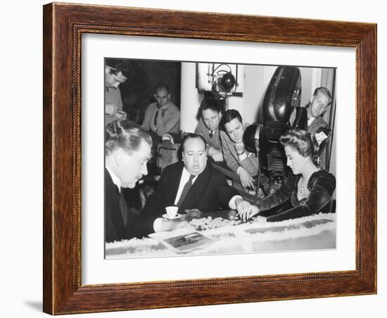 Director Hitchcock Directing a Scrabble Scene with Joan Fontaine in Suspicion-null-Framed Photo