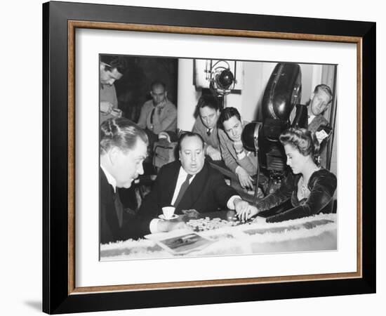 Director Hitchcock Directing a Scrabble Scene with Joan Fontaine in Suspicion-null-Framed Photo