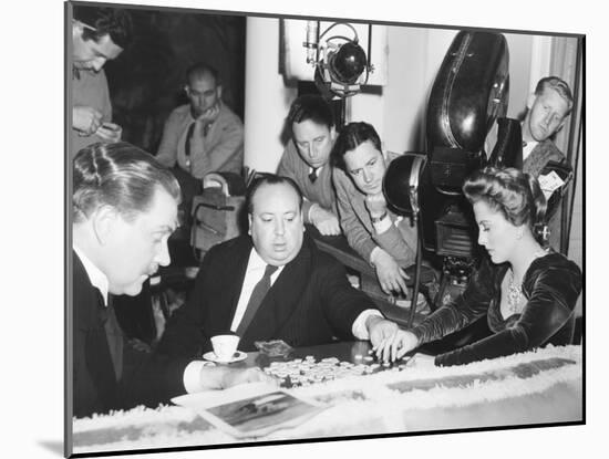 Director Hitchcock Directing a Scrabble Scene with Joan Fontaine in Suspicion-null-Mounted Photo