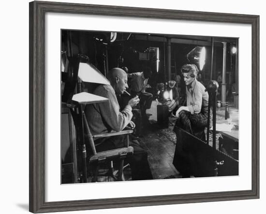 Director Howard Hawks Conferring with Actress Angie Dickinson on Set for "Rio Bravo"-Allan Grant-Framed Premium Photographic Print