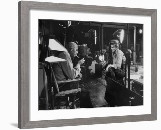 Director Howard Hawks Conferring with Actress Angie Dickinson on Set for "Rio Bravo"-Allan Grant-Framed Premium Photographic Print