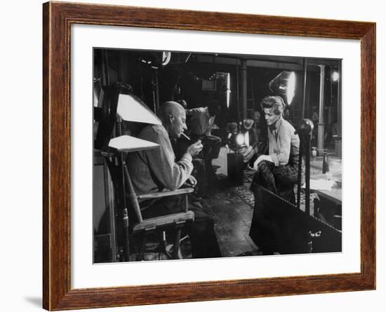 Director Howard Hawks Conferring with Actress Angie Dickinson on Set for "Rio Bravo"-Allan Grant-Framed Premium Photographic Print