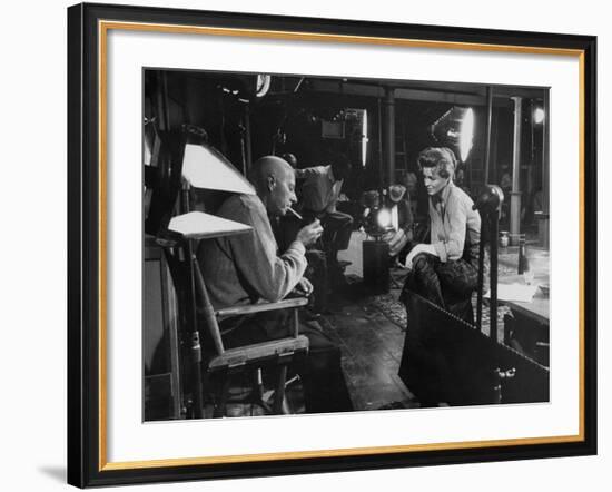 Director Howard Hawks Conferring with Actress Angie Dickinson on Set for "Rio Bravo"-Allan Grant-Framed Premium Photographic Print