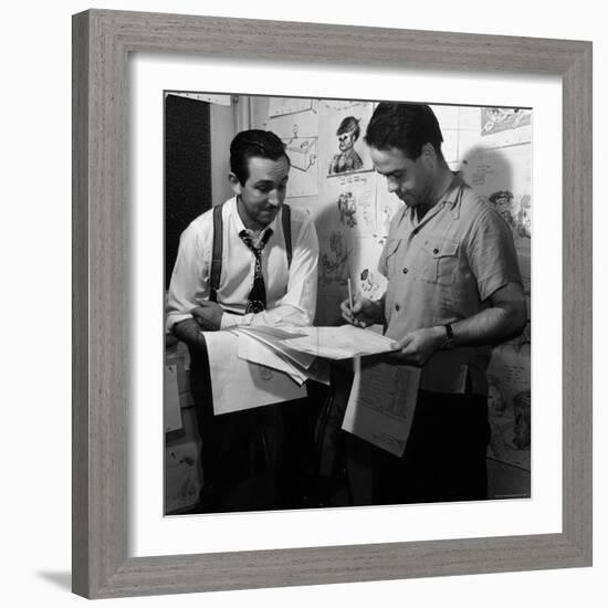 Director Walt Disney Looking over Sketches from His Latest Picture "Pinocchio."-Peter Stackpole-Framed Premium Photographic Print